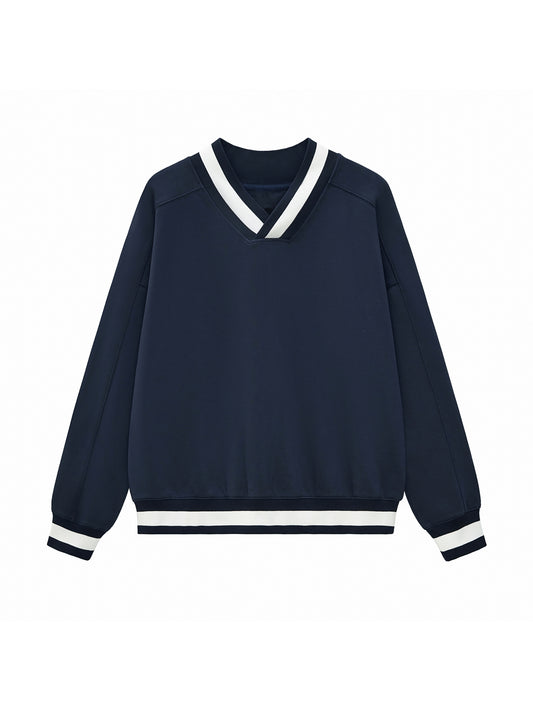 Navy blue sweater with white trim on a white background